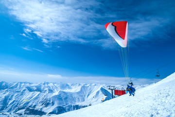 Winter in Greater Caucasus Mountains. Georgia (country). Gudauri ski resort. Paragliding