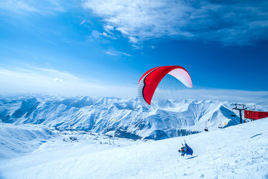 Winter in Greater Caucasus Mountains. Georgia (country). Gudauri ski resort. Paragliding
