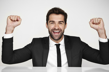 Happy businessman in suit, portrait