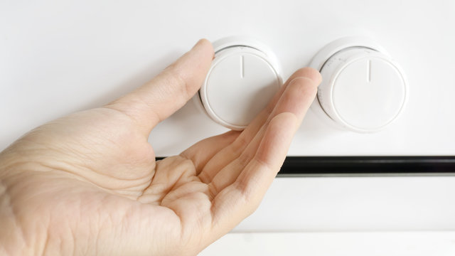 Woman Using Oven Controls