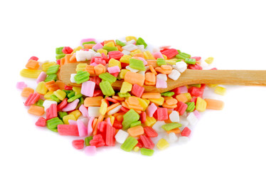 colorful candy in spoon isolated on white background