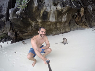 Man taking a selfie with Monkey in Phuket, Thailand