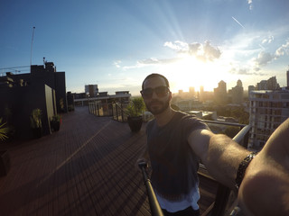 Man taking a selfie with Sydney Skyline on background, Australia