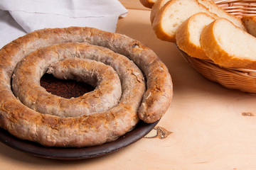 Baked traditional homemade sausage with spices and herbs.