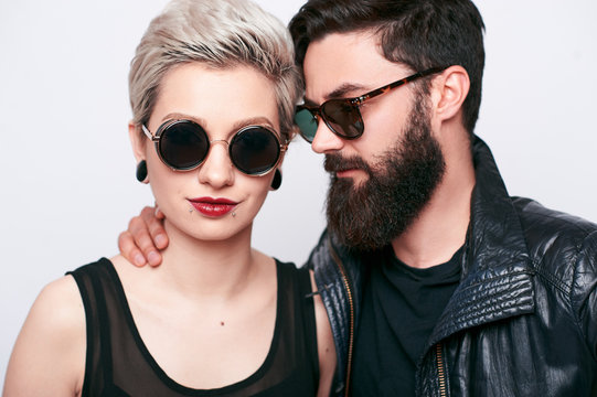 Fashion stylish bearded young man and blond woman