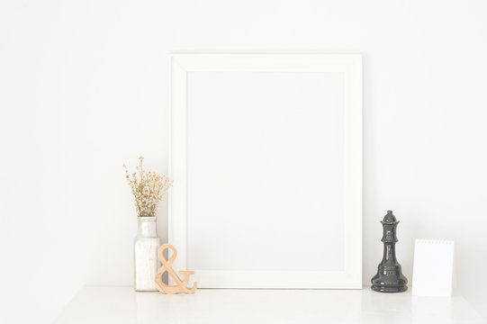 Frame white on white wooden table, put walls white background,Dried Flowers Place the frame © longkaud