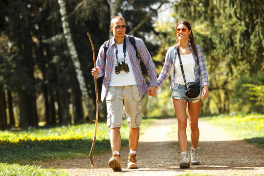 In the nature outdoors, a couple explores and hiking, relying on their instincts to navigate the beautiful surroundings.