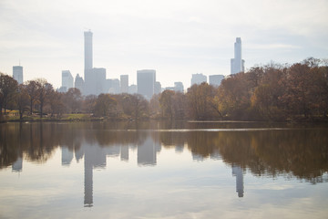 Fototapeta premium Towers metropolis of skyscrapers reflected in the pond Central P