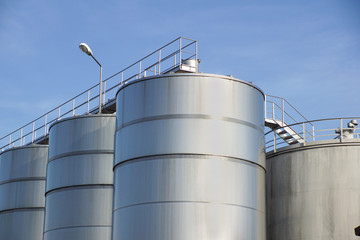 Detail of chemical plant, silos and pipes