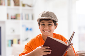 Kid with book at home