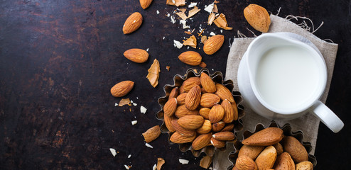 Obraz na płótnie Canvas Almond milk with ingredients and honey for healthy breakfast