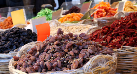 baskets of dried fruit for sale at the fruit market of Italy