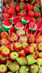 Fruit-shaped marzipan in baskets at a shop