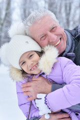 happy grandfather and granddaughter