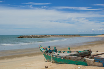 Fototapeta na wymiar Fishing boats parked on the beach during the day. (6)