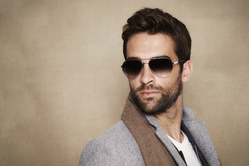Fototapeta premium Dude in scarf and shades, looking away