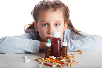 Obraz na płótnie Canvas Little sick girl does not want to take medication