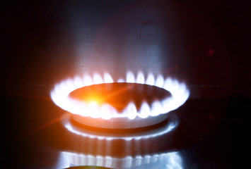 The burning torch on the gas stove