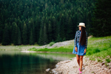 woman relax in pine forest and lake