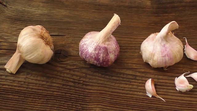 Garlic bulbs on wooden board, natural medicine, eat healthy food
