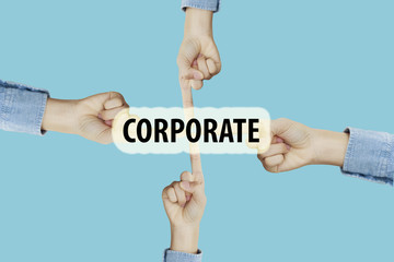 Many hands fingers pointing with index fingers to CORPORATE text