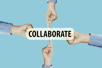 Many hands fingers pointing with index fingers to COLLABORATE te