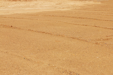 Yellow lined sand for asphalting on construction site at sunny d