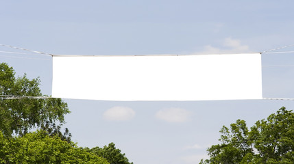 Blank banner with copy space stretched across blue sky. Horizontal.