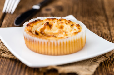 Mini Cheesecake on wooden background (selective focus)