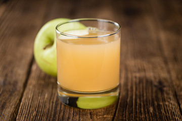 Apple Juice on vintage wooden background