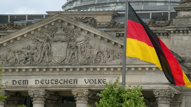 waving german flag in front of the bundestag close 11412
