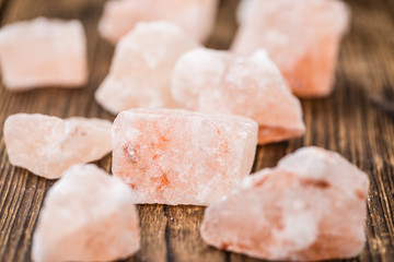 Wooden table with a portion of pink Salt