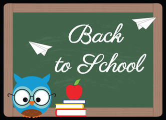 back to school, owl with glasses, books and red apple next to a blackboard with written on 