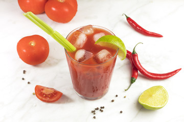Bloody Mary cocktail with lime, celery and chilis