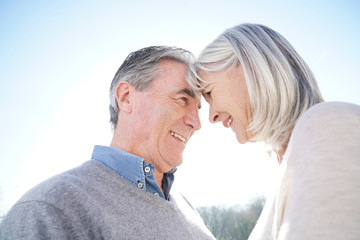 Portrait of senior couple embracing each other