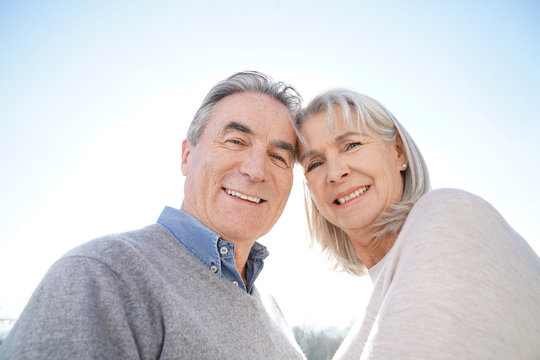 Portrait of senior couple embracing each other