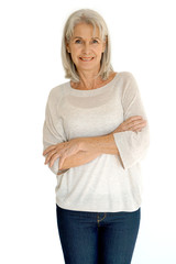 Senior woman standing on white background