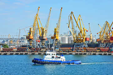 Tugboat and port cargo crane