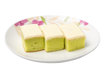 Square cake with cream in dish on white background