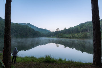 Viewpoint reflection foggy reservoir at dawn