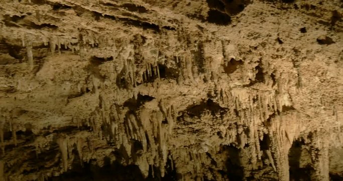 Stalactites and stalagmites in a limestone cave.