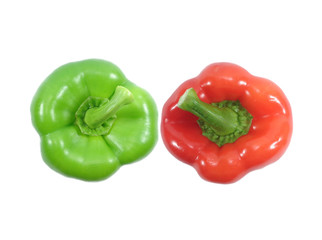Close-up of two ripe bright color bell peppers, one red and one green with stem isolated on white...