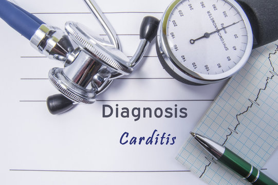 Cardiac diagnosis Carditis. Medical form report with written diagnosis of Carditis lying on the table in doctor cabinet, surrounded by stethoscope, tonometer and ecg. Concept for cardiology