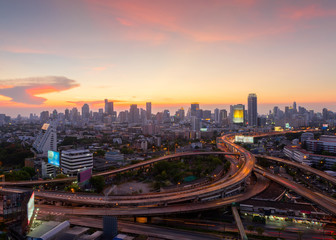 Naklejka na ściany i meble Bangkok Cityscape, business district with expressway , freeway and motorway , an important infrastructures in Bangkok at night ,Bangkok,Thailand