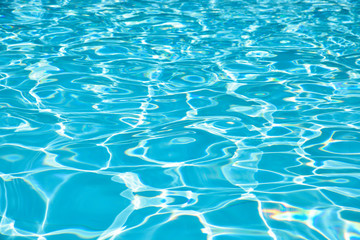 Blue water surface and ripple wave in pool