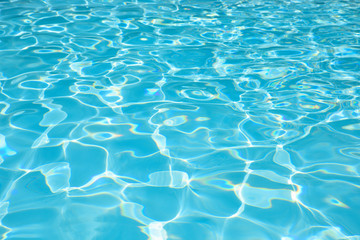 Naklejka na ściany i meble Beautiful ripple water surface with sun reflection in swimming pool
