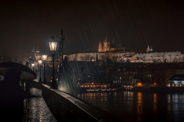 Fototapeta na wymiar Europe travel vacation concept. Vltava. Charles Bridges. Prague.Czech Republic. Rain. Night