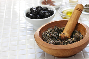 making tapenade, french black olive paste