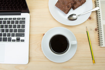 closeup top view of coffee cup on wooden table