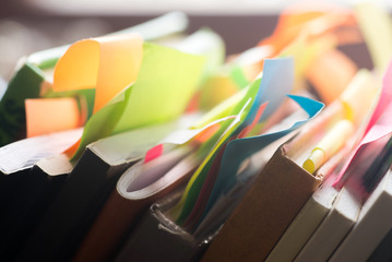 books and notebooks with multicolored stickers